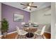 This dining room features a modern table, hardwood floors, and bright light at 14214 E 1St Dr # B08, Aurora, CO 80011