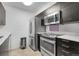 This kitchen features stainless steel appliances and modern cabinetry at 14214 E 1St Dr # B08, Aurora, CO 80011
