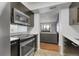 This kitchen features stainless steel appliances and modern cabinetry at 14214 E 1St Dr # B08, Aurora, CO 80011