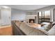 Inviting living room with fireplace, hardwood floors, couch, and access to the balcony with lots of light at 14214 E 1St Dr # B08, Aurora, CO 80011