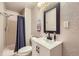 Updated bathroom with black fixtures, a shower, and new commode at 3268 E 136Th Pl, Thornton, CO 80602