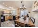 Well-lit kitchen with light wood cabinets, granite countertops, and modern appliances at 3268 E 136Th Pl, Thornton, CO 80602
