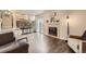 Living room with beautiful hardwood floors, fireplace, and seamless access to the backyard at 3268 E 136Th Pl, Thornton, CO 80602
