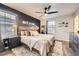 Spacious bedroom with hardwood floors, ceiling fan, and stylish decor for a relaxing retreat at 3268 E 136Th Pl, Thornton, CO 80602