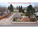 Aerial view of the property highlighting the detached garage and backyard at 7794 Louviers Blvd, Louviers, CO 80131