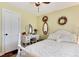 Bedroom featuring hardwood floors, a ceiling fan, and painted furniture at 7794 Louviers Blvd, Louviers, CO 80131