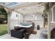Relaxing outdoor hot tub area with a pergola, privacy lattice, and serene ambiance, offering a perfect retreat at 7794 Louviers Blvd, Louviers, CO 80131