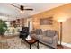 Inviting living room open to the kitchen with stylish decor and hardwood floors at 7794 Louviers Blvd, Louviers, CO 80131
