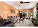 Cozy living room featuring textured walls, hardwood floors, and ample natural light at 7794 Louviers Blvd, Louviers, CO 80131