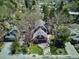 Aerial view of a beautiful home surrounded by mature trees and a well-manicured lawn in a quiet neighborhood at 2504 S Garfield St, Denver, CO 80210