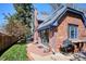 Backyard featuring a grill, a grassy lawn, a brick patio and a brick facade at 2504 S Garfield St, Denver, CO 80210