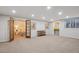 Finished basement featuring carpet, recessed lighting, bar area, and adjacent bedroom at 2504 S Garfield St, Denver, CO 80210