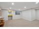 Spacious carpeted basement with window and wet bar area perfect for entertaining at 2504 S Garfield St, Denver, CO 80210