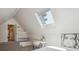 Bedroom with skylight, white desk and chair, and adjacent closet at 2504 S Garfield St, Denver, CO 80210