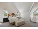 Cozy bedroom with vaulted ceilings, neutral decor, and lots of natural light at 2504 S Garfield St, Denver, CO 80210