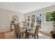 Elegant dining room featuring a glass table, neutral decor, and lots of natural light at 2504 S Garfield St, Denver, CO 80210