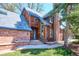 Attractive home with wood siding and a brick facade, complemented by steps leading to the front door at 2504 S Garfield St, Denver, CO 80210