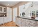 Stylish kitchen area with ample cabinet space, granite countertops, and modern lighting fixtures at 2504 S Garfield St, Denver, CO 80210