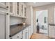 Charming kitchen area with custom cabinetry, granite countertops, and an open layout at 2504 S Garfield St, Denver, CO 80210
