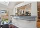 Bright kitchen features a breakfast bar, granite counters, and recessed lighting at 2504 S Garfield St, Denver, CO 80210