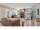 Inviting living room featuring a brick fireplace, plush seating, and abundant natural light at 2504 S Garfield St, Denver, CO 80210