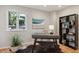 Cozy home office with hardwood floors, stylish desk, and ample natural light at 2504 S Garfield St, Denver, CO 80210