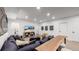 Finished basement rec room with sectional sofa and large TV at 2980 E 102Nd Pl, Thornton, CO 80229