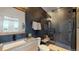 Modern bathroom with a walk-in shower and stylish finishes at 2980 E 102Nd Pl, Thornton, CO 80229