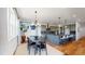 Open concept dining area with modern table and chairs, adjacent to the kitchen at 2980 E 102Nd Pl, Thornton, CO 80229