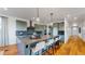 Modern kitchen with large island, breakfast bar, and ample counter space at 2980 E 102Nd Pl, Thornton, CO 80229