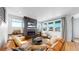 Bright living room with hardwood floors, fireplace, and comfortable seating at 2980 E 102Nd Pl, Thornton, CO 80229