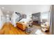 Spacious living room with hardwood floors, fireplace, and modern furniture at 2980 E 102Nd Pl, Thornton, CO 80229