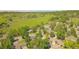 Aerial view of the home showcasing a lush, tree-filled neighborhood with easy access to nearby green spaces at 6842 Garland St, Arvada, CO 80004