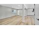 Spacious basement with hardwood flooring, a modern fireplace and ample light at 6842 Garland St, Arvada, CO 80004