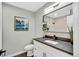 Stylish bathroom features dark countertop, undermount sink, and sleek fixtures at 6842 Garland St, Arvada, CO 80004