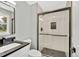 Modern bathroom featuring a black-accented glass shower and sleek fixtures at 6842 Garland St, Arvada, CO 80004