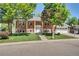 Charming two-story brick home with a well-manicured lawn and an attached two car garage at 6842 Garland St, Arvada, CO 80004