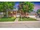 Charming two-story brick home featuring a well-manicured lawn and attached two car garage at 6842 Garland St, Arvada, CO 80004