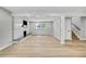 Bright living area showcasing hardwood floors and a contemporary marble fireplace at 6842 Garland St, Arvada, CO 80004