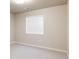 A minimalistic bedroom with neutral walls, carpet flooring, a window, and essential electrical outlets at 9091 E 61St Ave, Denver, CO 80238
