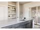 Bright kitchen showcasing quartz countertops, stylish cabinetry, and stainless steel appliances at 9091 E 61St Ave, Denver, CO 80238