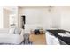 Inviting living space featuring comfortable seating and seamless flow into the kitchen and dining areas at 9091 E 61St Ave, Denver, CO 80238