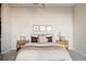 Neutral main bedroom showcases coordinated decor and accent throw at 9091 E 61St Ave, Denver, CO 80238