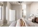 Neutral main bedroom features an ensuite and walk-in closet, showcasing coordinated decor at 9091 E 61St Ave, Denver, CO 80238