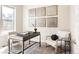 Home office with modern desk, patterned rug and a large window at 9091 E 61St Ave, Denver, CO 80238