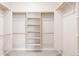 Spacious walk-in closet with white shelving and ample storage at 9091 E 61St Ave, Denver, CO 80238