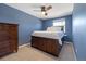 Cozy bedroom with wood floors, large window and a dark wood dresser at 2540 E Geddes Pl, Centennial, CO 80122
