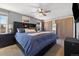 Comfortable bedroom featuring a ceiling fan, a large bed and ample closet space at 2540 E Geddes Pl, Centennial, CO 80122