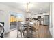 Bright dining area with sliding glass doors to the patio and modern decor at 2540 E Geddes Pl, Centennial, CO 80122