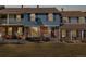 Charming townhome with a combination brick and siding facade and front yard at 2540 E Geddes Pl, Centennial, CO 80122